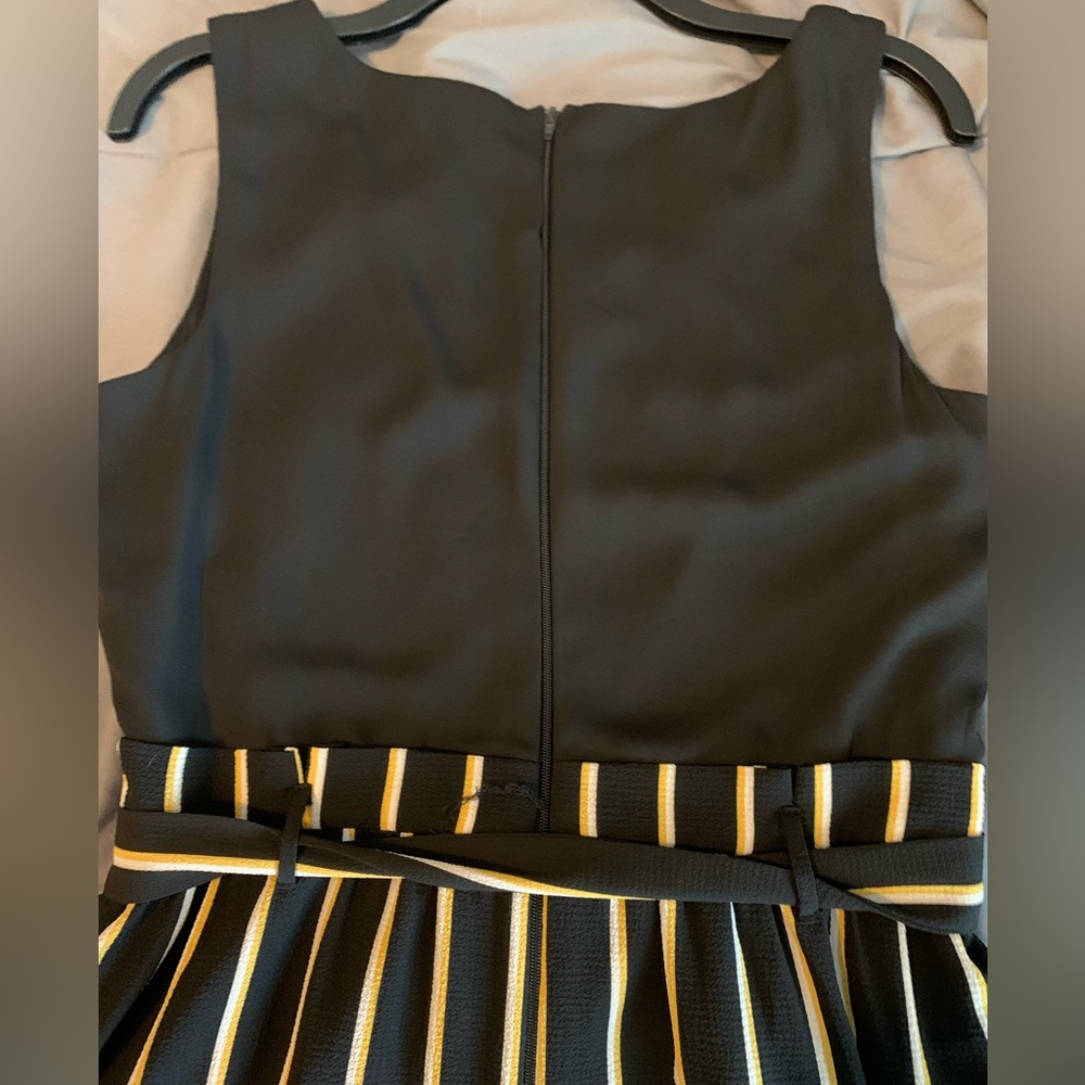 Black with yellow and white striped jumper
